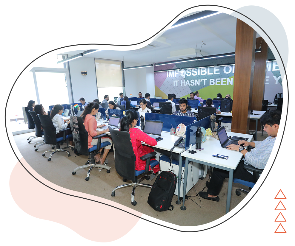 Microworld Infosol team collaborating in a modern office, showcasing diverse professionals in a dynamic work environment